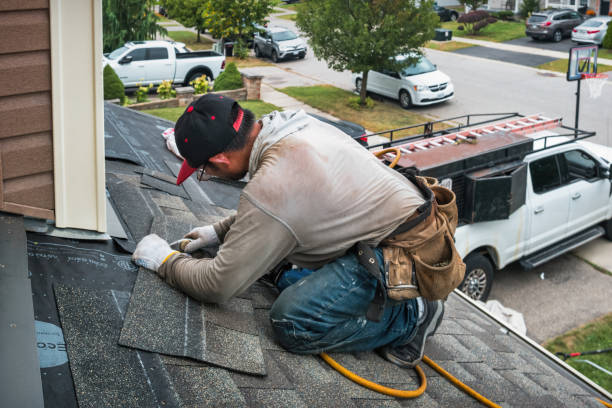 Professional Roof Replacement technician working in East Galesburg, IL